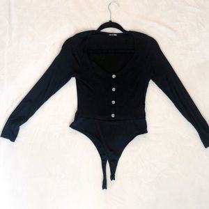 Black long sleeved body suite